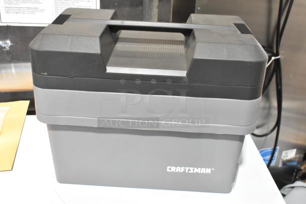 Craftsman gray tool box with contents, sturdy plastic, stackable design, visible logo, includes three boxes per bid.