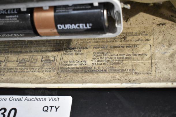 Corona 23-DK Portable Kerosene Heater, model 23-DK, 22,800 BTU/hr, 1.6-gallon capacity. Made in Japan.