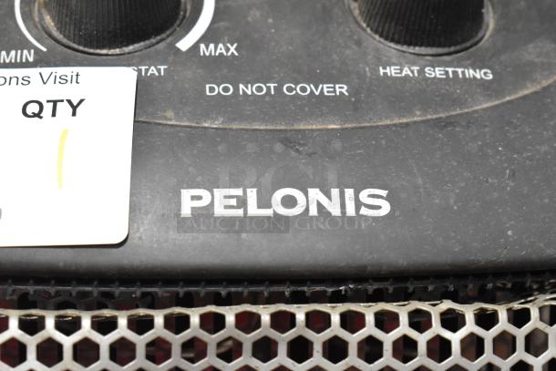 Pelonis HQ-1000B Quartz Heater, 120V, 1 Phase. Features control knobs and safety warnings. Visible wear on casing.