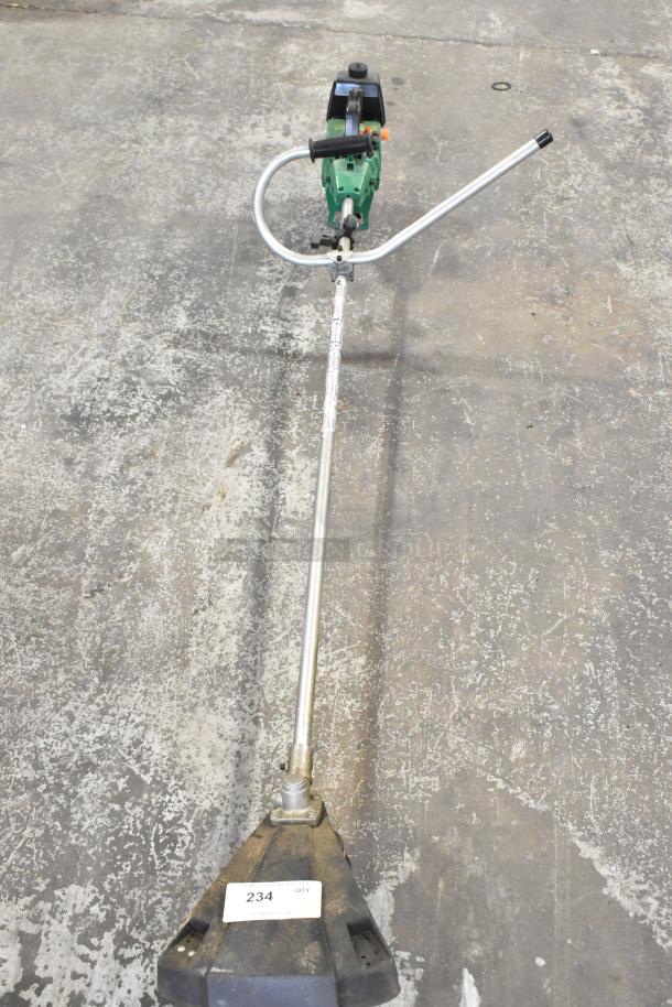 GTI 19T weed eater with green motor casing and metal shaft. Condition shows light wear. Label reads "234 QTY."
