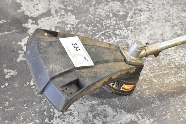 GTI 19T Weed Eater, used condition, black and silver, visible dirt, auction tag "234," metal shaft connection.