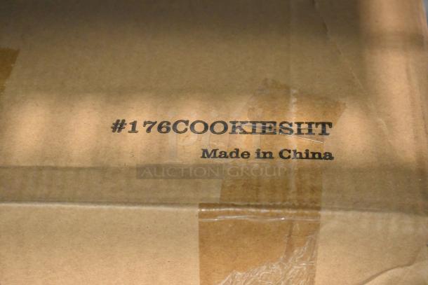Cardboard box with "#176COOKIESHT" and "Made in China" text, containing new Baker's Lane aluminum cookie sheets.