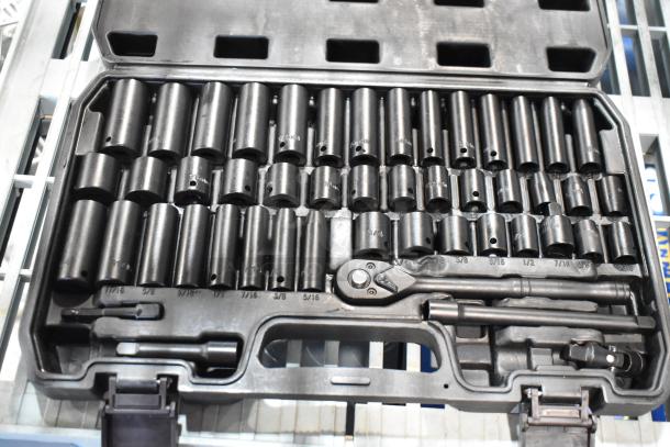 Black hard case with comprehensive wrench kit, including various socket sizes and accessories. Sturdy, well-organized condition.