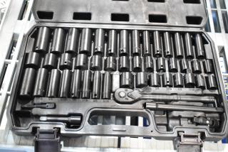 Black hard case with comprehensive wrench kit, including various socket sizes and accessories. Sturdy, well-organized condition.