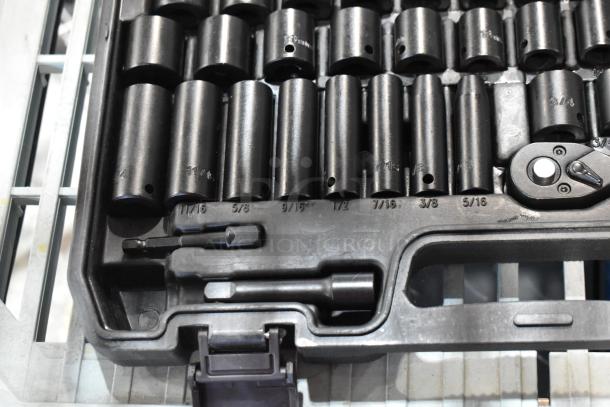 Black hard case with wrench kit, includes multiple socket sizes with marked measurements, in excellent condition.