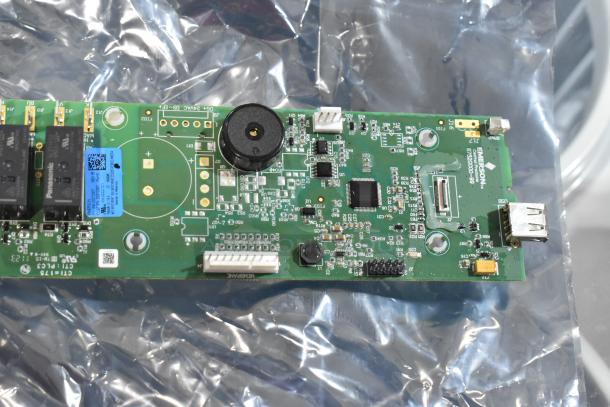 Amana Menumaster 59194640 Control Board, new condition, components visible, labeled Emerson, ideal for repairs.