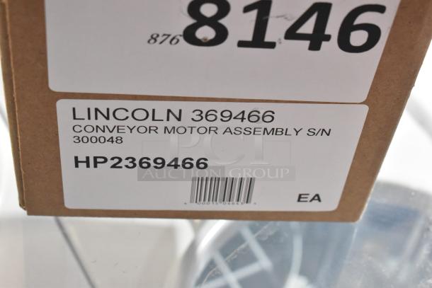Shipping box with a label for Lincoln 369466 Conveyor Motor Assembly S/N 300048, with barcode and part number HP2369466.