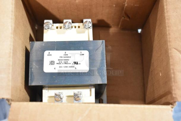 Transformer in box, label reads "480V, 240V, 50/60HZ, 120V, 200VA," indicating voltage specifications and origin.