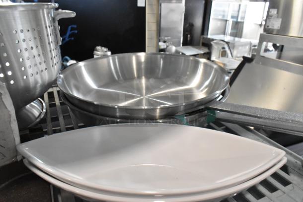 10 brand new kitchen items including 22" aluminum steamer, 16 qt. colander, and customizable steak knives.