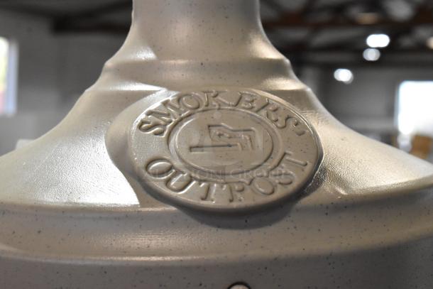 Brand new scratch and dent Commercial Zone 711402 beige 5 Qt. short cigarette receptacle, embossed "Smokers' Outpost" logo.