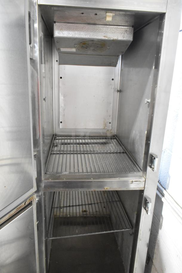 Traulsen ADT132KUT-HHS stainless steel dual temp cooler and freezer with racks, half-size doors, on commercial casters.