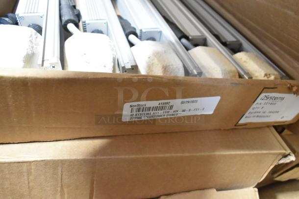 9 new i2Systems 221900 LED strips in box, scratch and dent condition, with visible labels indicating model and owner details.