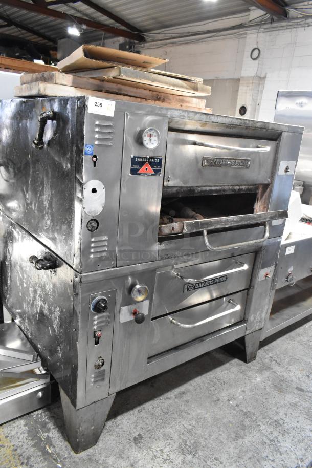 2 Bakers Pride stainless steel gas pizza ovens with cooking stones. Used condition, visible label, control knobs.
