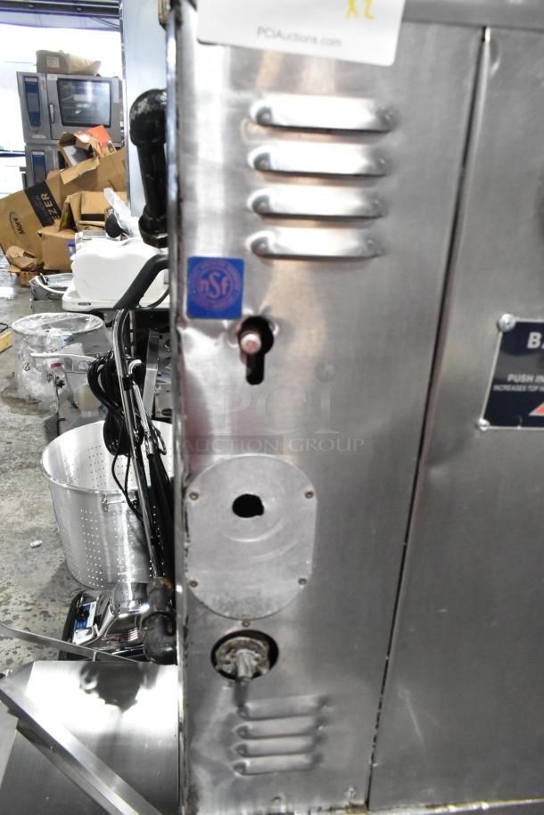 Bakers Pride stainless steel commercial gas-powered single deck pizza oven, NSF certified, visible vents and controls.