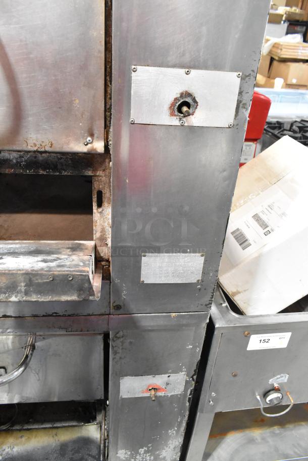 Bakers Pride stainless steel commercial gas pizza oven with cooking stones, single deck, used condition, visible wear.