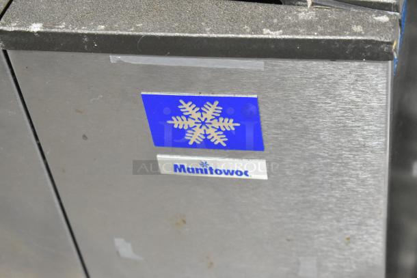 Manitowoc SD0453W stainless steel ice head, 115V, 1 phase. Visible Manitowoc logo, blue snowflake emblem. Good condition.