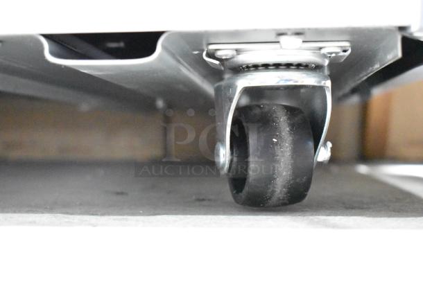 Close-up of commercial caster on Avantco 360DFC20HCL display ice cream freezer. Brand new, customizable design.