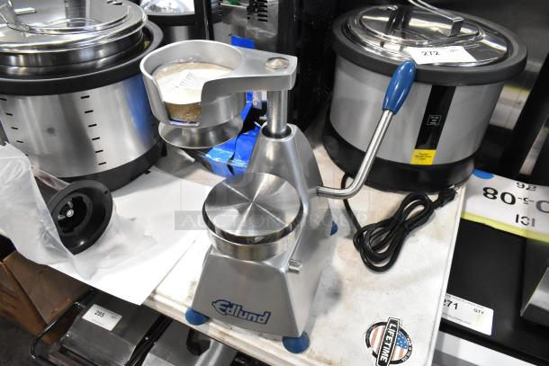 BRAND NEW Edlund Metal Commercial Patty Former, minor scratches, with handle and base. Edlund logo visible.