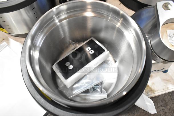 Brand new Vollrath 7411 Mirage® 11 Qt. induction rethermalizer. Visible control panel, accessories in packaging. 120V, 1 Phase.