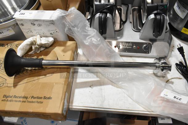 Brand new VitaMix VM0246 immersion blender blade, stainless steel, with original packaging. Some surface packaging damage.