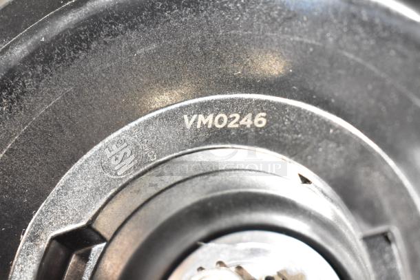 Brand new VitaMix VM0246 immersion blender blade with minor scratches. Model and certification markings visible.