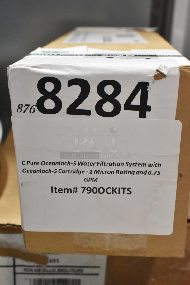 Cardboard box with label for C Pure Oceanloch-S Water Filtration System, 1 micron, 0.75 GPM, item 790OCKITS. New condition.