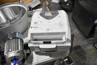 Brand new San Jamar roll towel dispenser with scratch and dent. White, tabletop, labeled with usage instructions.