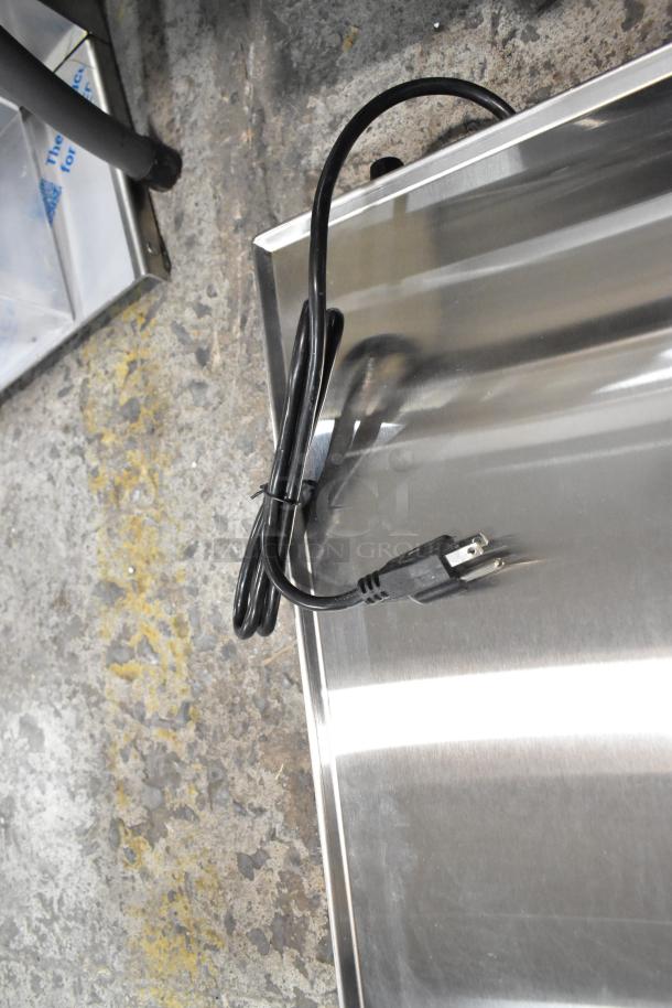 Brand new ServIt 423HSW2024 24" stainless steel heated shelf warmer. Scratch and dent model, shows power cord. 120 Volts, 1 Phase.