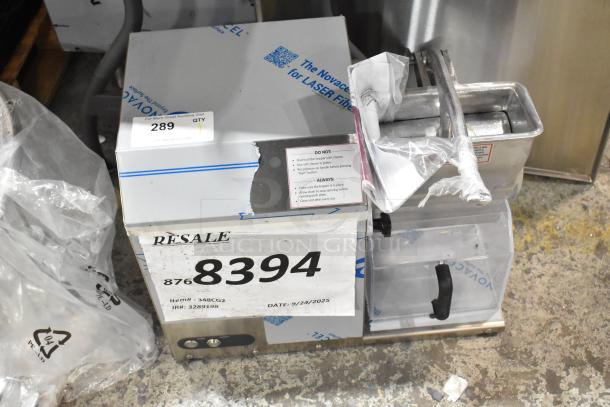 Brand new Estella 348CG2 stainless steel electric hard cheese grater, 4 lb/min, 120V, 1 phase, minor scratches visible.