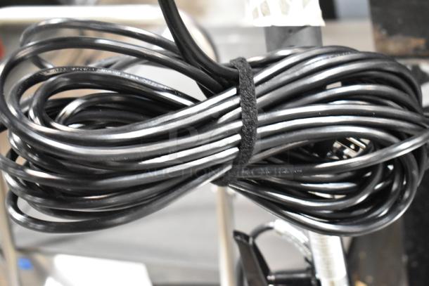 Coiled black power cord of Lavex P101 Commercial Vacuum Cleaner, 120V, scratch, and dent condition.