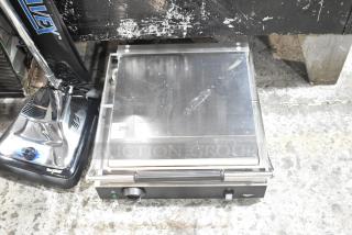 BRAND NEW 2025 Vollrath TSI7021 stainless steel Panini grill, 17"x16" smooth plates, 120V, minor scratches, model tag visible.