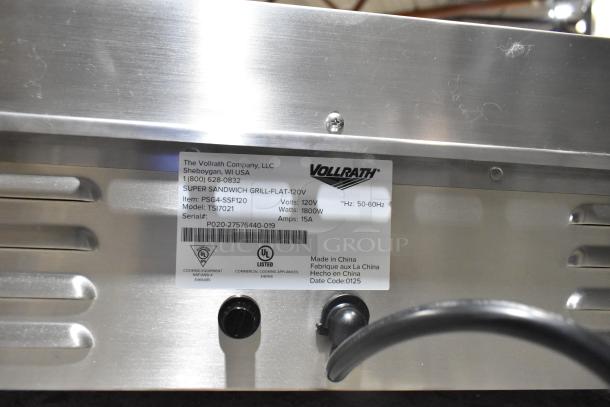 Brand new Vollrath TSI7021 Panini Grill, 2025 model, stainless steel, smooth plates, 17"x16". Label shows model and voltage details.