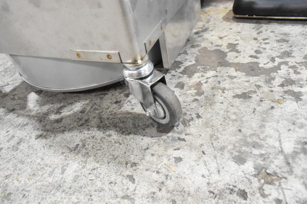 BRAND NEW Miroil BD707 portable fryer oil filter machine wheel close-up. Features a 1-way pump, 1/2 hp motor, 120 volts.