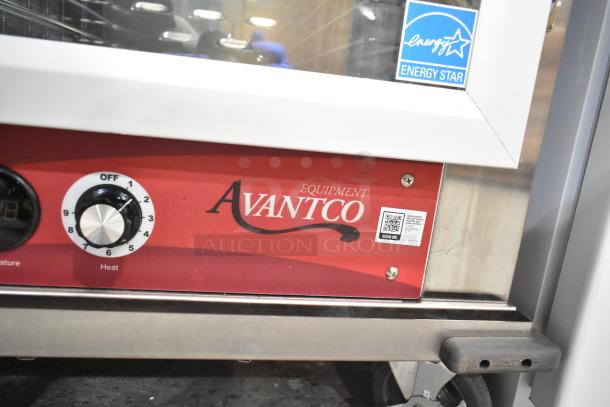 Avantco 177HTESC1836 heated holding cabinet with clear door, Energy Star label, temperature dial, and QR code on red panel.