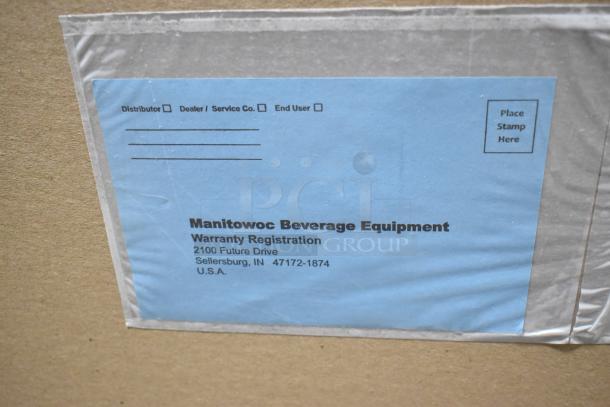 Close-up of Manitowoc Beverage Equipment warranty registration card, blue, indicating location in Sellersburg, IN, USA.