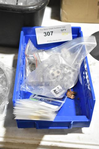 Lot of 21 brand new items including gasket 001022-45 for Eterna Cartridge, meat grinder discs in a blue bin. Quantity tag visible.