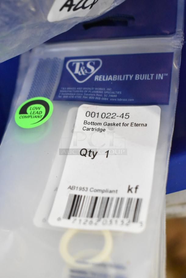 Lot of 21 new scratch and dent items including 001022-45 bottom gasket for Eterna cartridge. T&S packaging labeled low lead compliant.