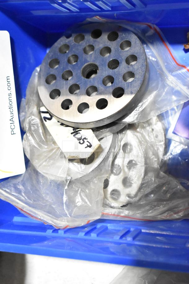 Lot of 21 new scratch and dent items including Eterna Cartridge bottom gasket and meat grinder discs in blue bin.