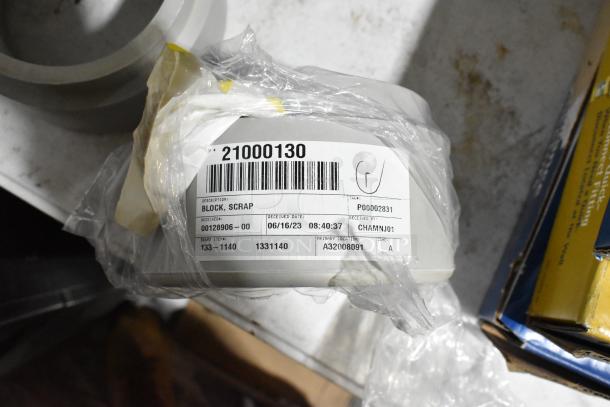 Brand new ALLP 32-1102 Scrap Block, item 21000130. Labeled as "Block, Scrap" with barcode. Packaged in plastic wrap.