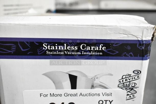 Stainless carafe box labeled "Stainless Vacuum Insulation," showing light damage on the packaging corner.