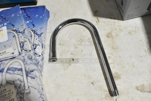 2 brand new T&S 120X gooseneck faucets, scratch and dent; chrome finish, packaging visible, offers twice your bid.