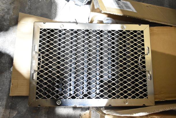 Brand new metal filter in original packaging with a diamond mesh design. Visible signs of slight dents.