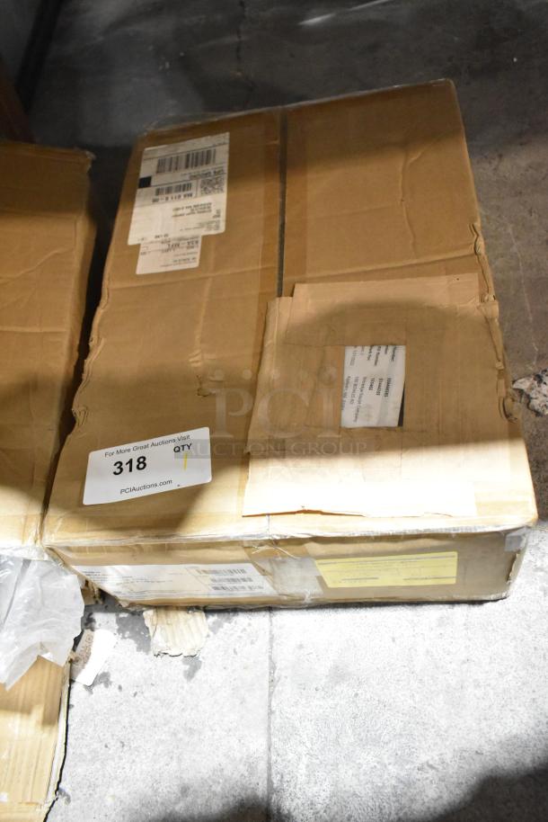 Cardboard boxes labeled for auction with visible shipping and auction tags; minor dents and scratches present.