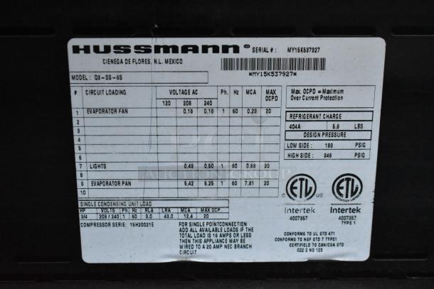Hussmann Q3-SS-6S Merchandiser label showing model, voltage (208/240V, 1 Phase), refrigerant, and certification details.