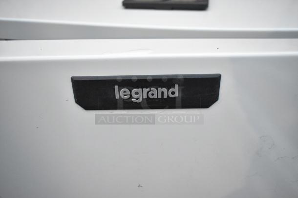 Legrand gray metal cabinet with a sleek finish; brand label visible, in good condition.