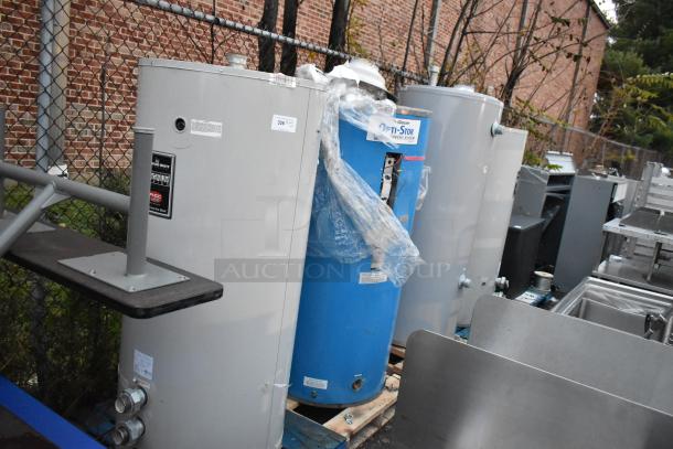 Four tanks including three Bradford White units and a Glacier Opti-stor Heat Recovery System, shown in industrial setting.