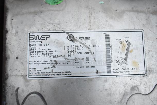 SWEP metal unit label showing item number 0111282.0, serial 311087202001155, manufactured in 2011, RoHS compliant.