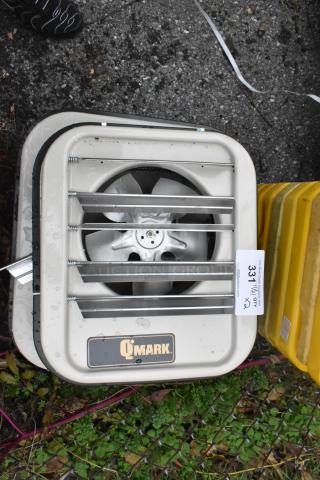 Two QMark MUH0541 480V unit heaters, metal casing, visible fan, QMark logo, auction tag indicating quantity x2.