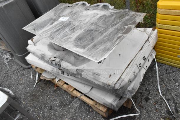 Nine various items including stainless steel toilet paper dispensers and PT44070 2'x4' LED light panel, on a pallet.