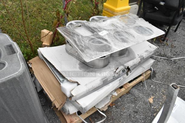 9 various items including stainless steel toilet paper dispensers and PT44070 2'x4' LED light panel, on a pallet.